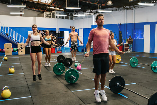Group of athletes jumping with ropes
