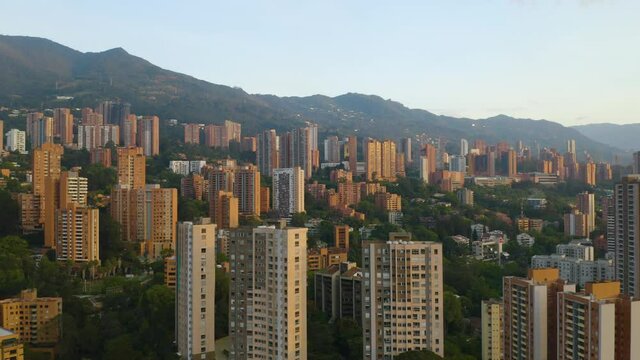 Drone Flies Towards Gorgeous Medellin Skyline set in the Andes Mountains of Colombia.