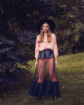 Fashion photo of a girl in a dress with a transparent skirt
