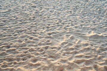 Tropical sand texture pattern, sandy beach texture background top view with copy space in summer day with Sunset light or sunrise light on beach