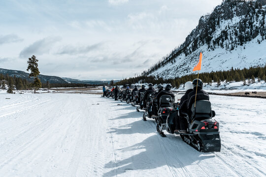 tourning Yellowstone National Park by snowmobile