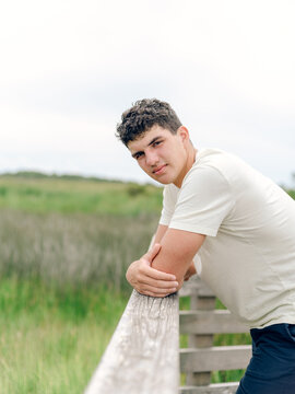 Senior photos of teen boy at marshland