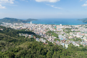 Fototapeta premium Amazing Landscape nature view from Drone camera High angle view of patong bay with mountain range in the foreground.Patong city in phuket thailand