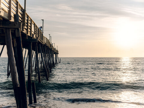Pier at the beach during sunset