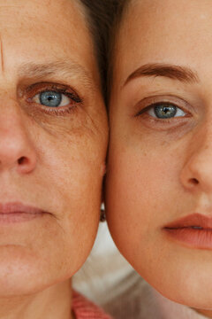 Crop mother and daughter looking at camera
