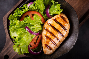 Tasty grilled chicken with salad.