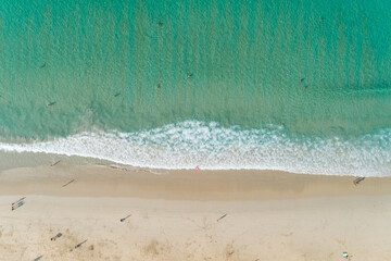 Fototapeta na wymiar Top view aerial view of amazing seascape with paradise beach and sea with turquoise water.Summer vacation holidays in Phuket beach Thailand.Beautiful website and travel background with copy space area