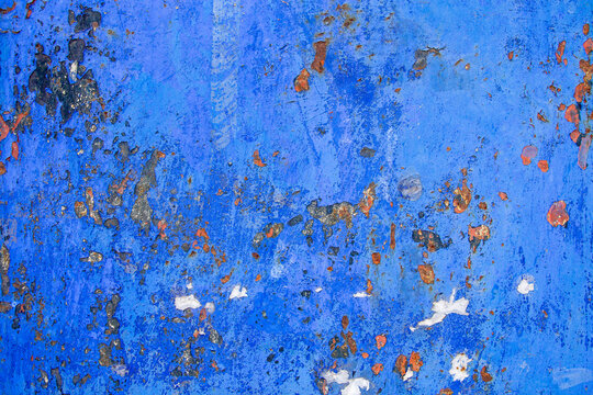 Texture of corroding metal with grungy blue paint