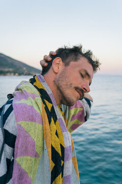 Young man with mustache after swimming