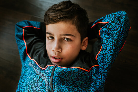 Portrait of 12 year old boy laying down.