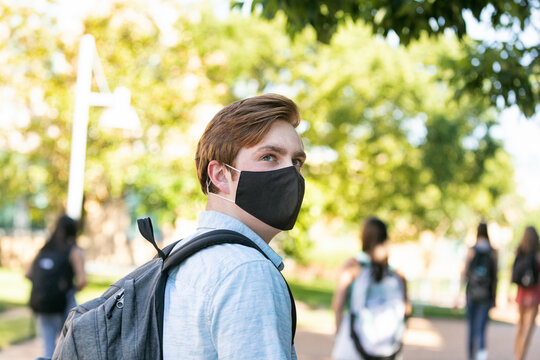 Covid: Male College Student Looks Back Over Shoulder