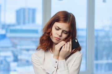 Business woman talking on the phone in the office technology professional