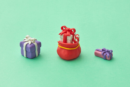 Handmade colorful plasticine figure of Christmas gifts.