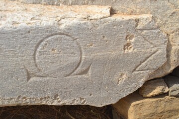 Ancient Greek Ruins with letters Omega and Sigma found at Delos Greece
