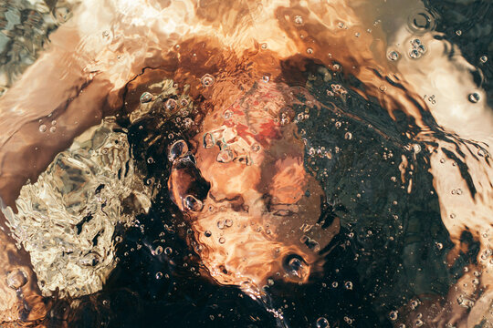 Unrecognizable woman underwater