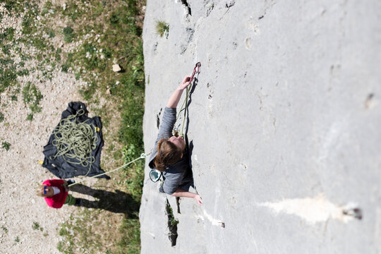 Adventurous Woman Rock Climbing Outdoors