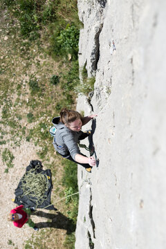 Adventurous Woman Rock Climbing Outdoors