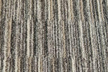 Texture of carpet floor close-up. Brown carpet with a pattern.