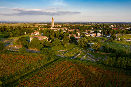 Cultivated fields, Archaeological Area and the Patriarchal Basilica of Aquileia, Italy.