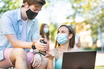 Covid: Friends Doing Remote School Work On Phone And Laptop