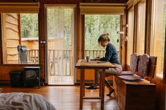 Woman in a cabin lodge