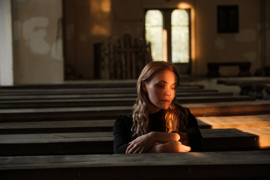 A girl in an abandoned Church