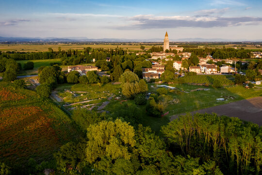 Cultivated fields, Archaeological Area and the Patriarchal Basilica of Aquileia, Italy.