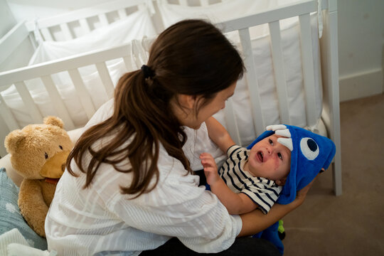 Young Mom Playing With Her Baby.