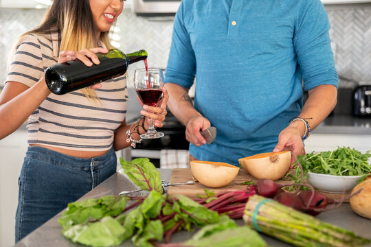 Woman Pouring Wine With Partner