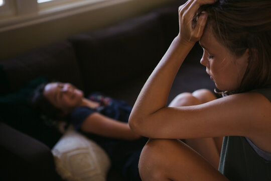 Two sisters having a disagreement at home.