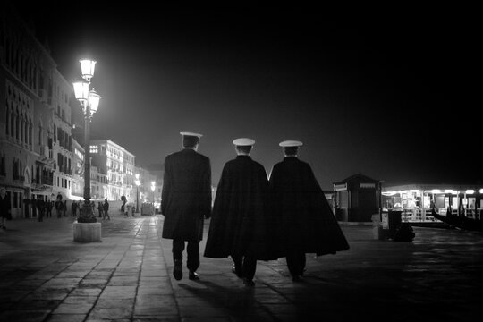 Three Venetian officers walking