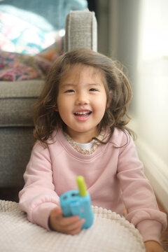 Child playing with walkie-talkie toy
