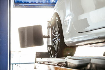 Wheel check up on lift in garage