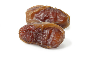 Two dried tasty dates isolated on white