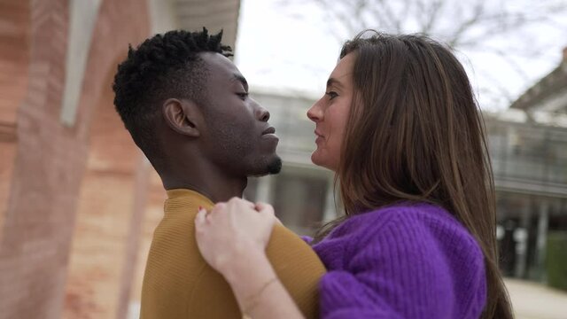 Interracial couple lovers romance. Young millennial girlfriend and boyfriend kiss