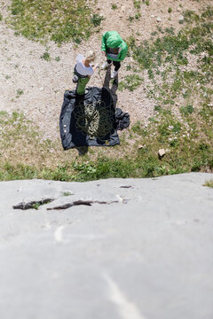Adventurous Woman Getting Ready for Rock Climbing