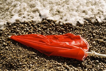 Broken sunshade on the beach.