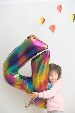 Child with birthday balloon