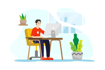 A man sitting in front of a computer working from home during quarantine time