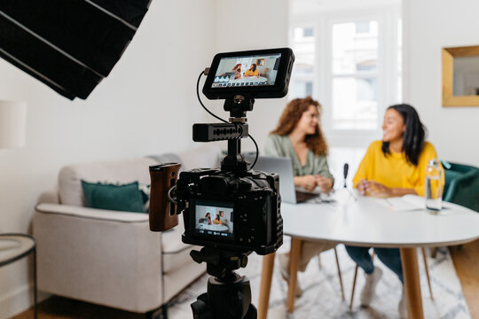 Ethnic women recording podcast together