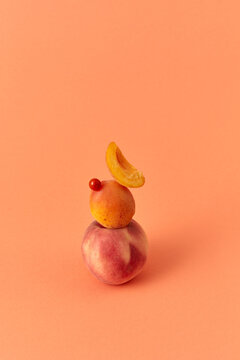 Fruit balancing pyramid from peach and apricots.