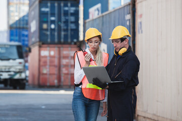 working engineer in the construction container yard.  worker and supervisor checking containers data. Container Shipping Logistics Engineering concept