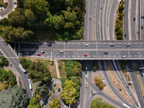 transportation, cars driving on a big intersection road, aerial view