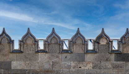 Fototapeta premium The walls of the old palace on the background of a blue sky