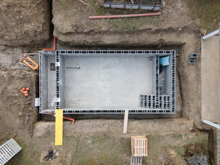 Drones aerial photo of a construction site of a pool, formwork concrete blocks already finished and...