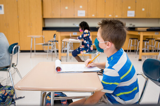 Boy with mask in a reduced size class