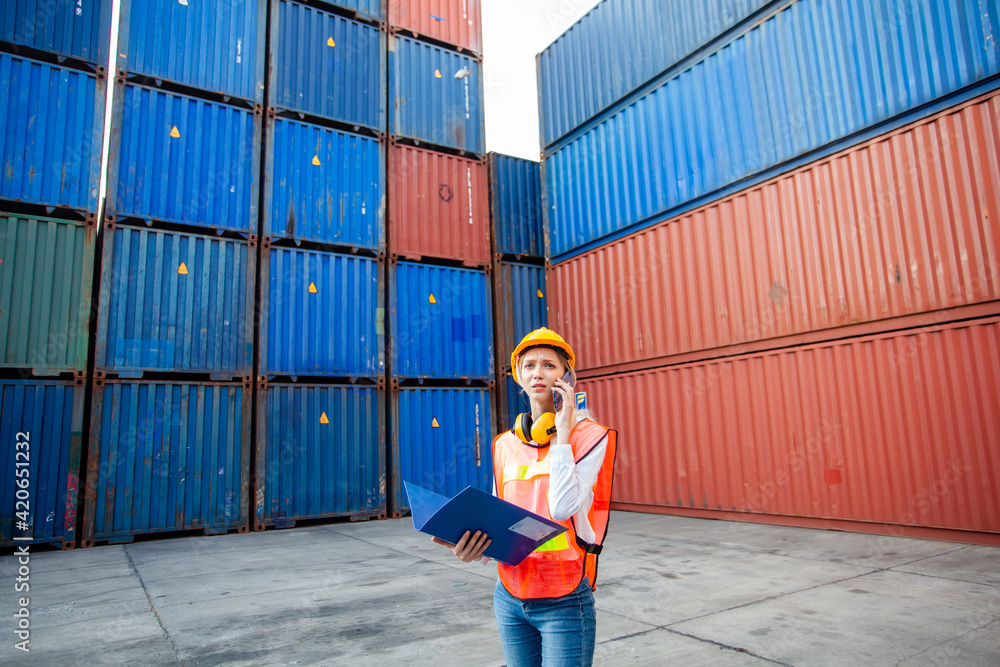 Poster foreman control loading containers box from cargo freight ship. business logistic concept, import an