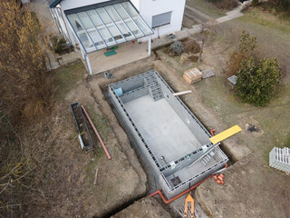 Drones aerial photo of a construction site of a pool, formwork concrete blocks already finished and...