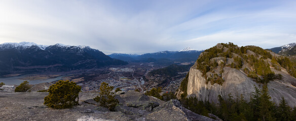 Fototapeta na wymiar Panoramic View of Beautiful Canadian Landscape and Squamish City during a sunny sunset. Taken from Chief Mountain, near Vancouver, British Columbia, Canada.