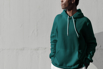 Man in green hoodie streetwear men&rsquo;s apparel fashion